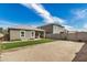 View of the backyard featuring gravel, small patch of grass and a covered patio at 6513 W Latona Rd, Laveen, AZ 85339