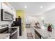 Modern kitchen with granite countertops, stainless steel appliances, and white cabinets at 6513 W Latona Rd, Laveen, AZ 85339