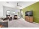 Inviting living room with bright windows, neutral carpet, and modern ceiling fan at 6513 W Latona Rd, Laveen, AZ 85339