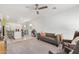 Open-concept living space with a modern sofa and adjacent kitchen area at 6513 W Latona Rd, Laveen, AZ 85339
