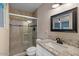 The bathroom boasts granite countertops, designer faucets, and a glass-enclosed walk-in shower at 7226 E Virginia Ave, Scottsdale, AZ 85257
