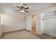 This bedroom features a ceiling fan, wood floors, and a closet for optimal storage at 7226 E Virginia Ave, Scottsdale, AZ 85257