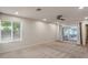 Large primary bedroom with neutral carpet, recessed lighting, ceiling fan, and a sliding glass door to backyard at 7226 E Virginia Ave, Scottsdale, AZ 85257