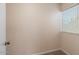 This bedroom is of average size and features a window and neutral carpeting at 7226 E Virginia Ave, Scottsdale, AZ 85257