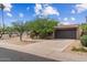 Street view of a single-story home with mature landscaping and an extended driveway at 7226 E Virginia Ave, Scottsdale, AZ 85257