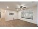 Bright living area with wood-look floors and a large window providing natural light at 7226 E Virginia Ave, Scottsdale, AZ 85257