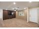 Spacious living room features wood-look flooring, modern ceiling fan, and ample natural light at 7226 E Virginia Ave, Scottsdale, AZ 85257