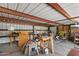 The interior of this shed has an exposed ceiling, work tables, and great space for working at 7226 E Virginia Ave, Scottsdale, AZ 85257