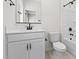 Bathroom with a white vanity, black fixtures, and a shower-tub combination at 7446 S 75Th Dr, Laveen, AZ 85339