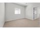 Bedroom featuring plush carpet, a window with blinds, and ample natural light for a cozy retreat at 7446 S 75Th Dr, Laveen, AZ 85339