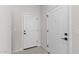 Entryway featuring tile flooring and white paneled doors at 7446 S 75Th Dr, Laveen, AZ 85339