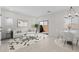 Bright living room featuring modern decor, neutral tones, stylish furniture, and sliding glass doors to bring in lots of light at 7446 S 75Th Dr, Laveen, AZ 85339