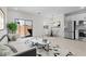 Open living space featuring dining area, stainless steel refrigerator, and sliding glass door at 7446 S 75Th Dr, Laveen, AZ 85339