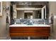 Modern bathroom featuring a floating double sink vanity with marble backsplash and contemporary fixtures at 8541 N Farview Dr, Scottsdale, AZ 85258