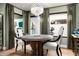 Bright dining area with large windows, stylish decor, and elegant chandelier at 8541 N Farview Dr, Scottsdale, AZ 85258