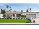 Charming single-story home with manicured front yard, mature trees and a tile roof at 8541 N Farview Dr, Scottsdale, AZ 85258