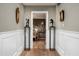 Inviting hallway with hardwood floors and decorative art leading to the Primary bedroom at 8541 N Farview Dr, Scottsdale, AZ 85258