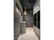 Contemporary laundry room with modern washer and dryer, custom cabinets, and chic lighting at 8541 N Farview Dr, Scottsdale, AZ 85258