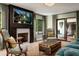 Cozy living room featuring a fireplace, comfortable seating, and elegant decor at 8541 N Farview Dr, Scottsdale, AZ 85258