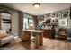 Bright office with a modern wood desk, gallery wall and vintage furnishings, filled with natural light at 8541 N Farview Dr, Scottsdale, AZ 85258