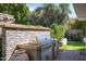 Outdoor kitchen features a built-in grill on a brick patio, perfect for entertaining in the backyard at 8541 N Farview Dr, Scottsdale, AZ 85258