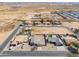 A high angle aerial view showcases the neighborhood homes, roads, and desert surroundings at 918 E Lincolnwood Cir, Casa Grande, AZ 85194
