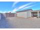 Large backyard featuring a patio, secure gated area, and plenty of space for landscaping or outdoor hobbies at 918 E Lincolnwood Cir, Casa Grande, AZ 85194