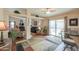 Open-concept living room with multiple seating areas and a fireplace feature at 918 E Lincolnwood Cir, Casa Grande, AZ 85194