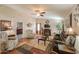 Spacious living room with a ceiling fan, fireplace, and hardwood floors at 918 E Lincolnwood Cir, Casa Grande, AZ 85194