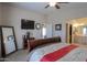Comfortable main bedroom featuring an attached bathroom at 918 E Lincolnwood Cir, Casa Grande, AZ 85194