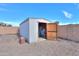 Convenient outdoor storage shed with open doors, providing ample space for tools and equipment at 918 E Lincolnwood Cir, Casa Grande, AZ 85194