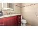 Bathroom with granite countertops, light wood cabinetry, and an illuminated mirror at 10015 E Mountain View Rd # 2017, Scottsdale, AZ 85258