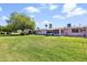 The beautiful green backyard with enclosed patios of the residential homes at 10408 N 105Th Ave, Sun City, AZ 85351