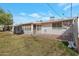 Spacious backyard with lush green grass, covered patio and partial privacy fence is an entertainer's dream at 10408 N 105Th Ave, Sun City, AZ 85351