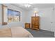 View of a bedroom with white brick walls, grey carpet, and a ceiling fan at 10408 N 105Th Ave, Sun City, AZ 85351