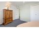 Comfortable bedroom with an armoire and a ceiling fan offering ample storage space at 10408 N 105Th Ave, Sun City, AZ 85351