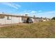 A single story home with white siding, an air conditioning unit, and a small lawn at 10408 N 105Th Ave, Sun City, AZ 85351