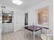 View of kitchen nook with table and view to adjacent living space at 10408 N 105Th Ave, Sun City, AZ 85351