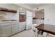 A view of the gray-cabineted kitchen looking towards the eating area at 10408 N 105Th Ave, Sun City, AZ 85351
