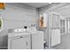 Inside laundry room with washer and dryer and access door to the patio at 10408 N 105Th Ave, Sun City, AZ 85351