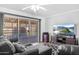 Comfortable living room featuring a large sliding glass door to the patio at 10408 N 105Th Ave, Sun City, AZ 85351