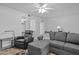 Open living room featuring comfortable seating and a view into the kitchen at 10408 N 105Th Ave, Sun City, AZ 85351
