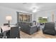 Inviting living area with stylish furniture and a sliding glass door at 10408 N 105Th Ave, Sun City, AZ 85351