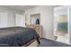 Well-lit bedroom showcasing a dresser and open entry to the ensuite bathroom with shower at 10408 N 105Th Ave, Sun City, AZ 85351