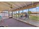 View of an enclosed patio with tile flooring, a ceiling fan and backyard views at 10408 N 105Th Ave, Sun City, AZ 85351
