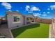 Lush backyard with low-maintenance turf and covered patio, ideal for outdoor enjoyment and entertaining at 10726 E Tallahassee Ave, Mesa, AZ 85212