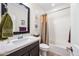 Well-lit bathroom featuring a vanity with a quartz countertop and a shower-tub combo, perfect for relaxation at 10726 E Tallahassee Ave, Mesa, AZ 85212