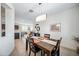Cozy dining area overlooking the open-concept kitchen and living space at 10726 E Tallahassee Ave, Mesa, AZ 85212