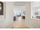 Open entryway showcasing the home's spacious layout with views of the kitchen and living area at 10726 E Tallahassee Ave, Mesa, AZ 85212