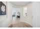 Inviting entryway with a decorative rug, leading into the home's open and airy living spaces at 10726 E Tallahassee Ave, Mesa, AZ 85212